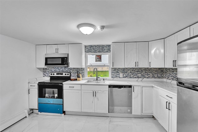 104 Schmidt Ave, Holbrook, NY 11741 - kitchen with stainless steel appliances, a baseboard heating unit, light marble finish flooring, and white cabinets
