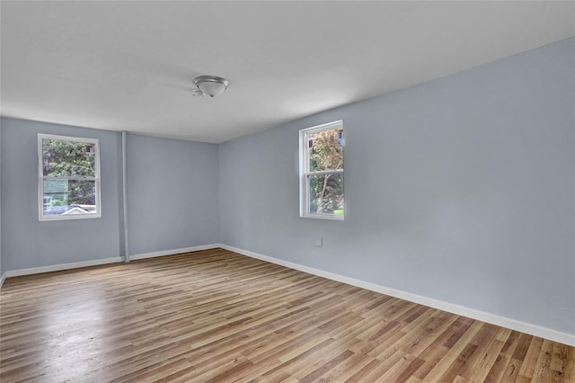 104 Schmidt Ave, Holbrook, NY 11741 - spare room featuring wood finished floors and plenty of natural light