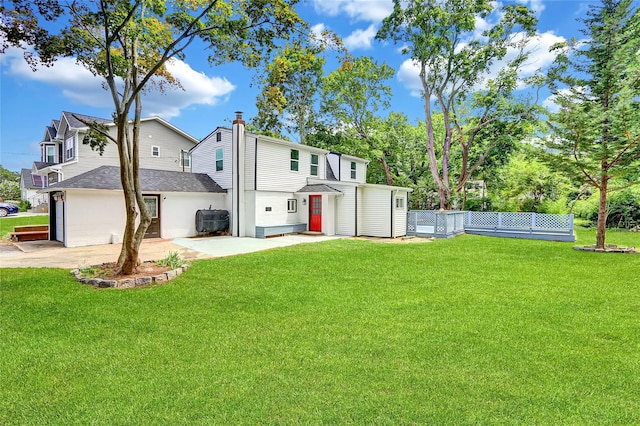 104 Schmidt Ave, Holbrook, NY 11741 - rear view of property with a shingled roof and a chimney