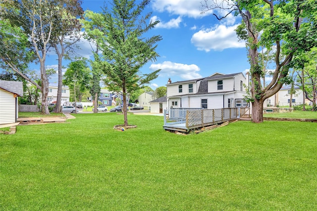 104 Schmidt Ave, Holbrook, NY 11741 - view of green lawn featuring a wooden deck and a residential view