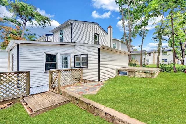 104 Schmidt Ave, Holbrook, NY 11741 - back of house with a lawn and a deck