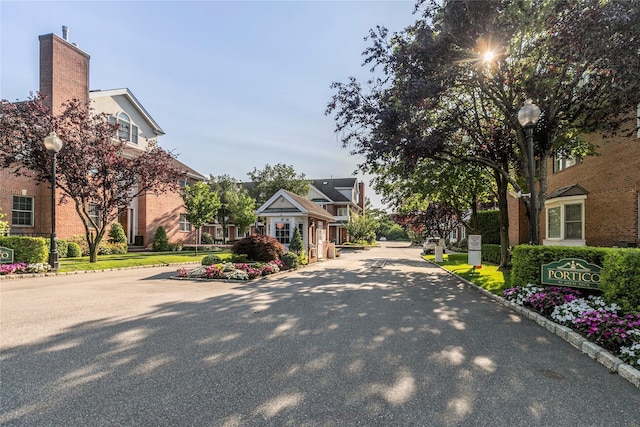 1 Portico Ct Unit 200, Great Neck, NY 11021 - view of asphalt street with street lights, curbs, and a residential view