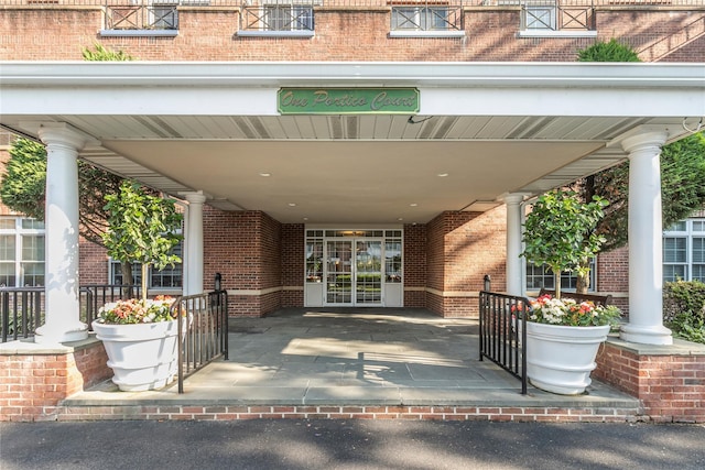 1 Portico Ct Unit 200, Great Neck, NY 11021 - view of exterior entry featuring brick siding