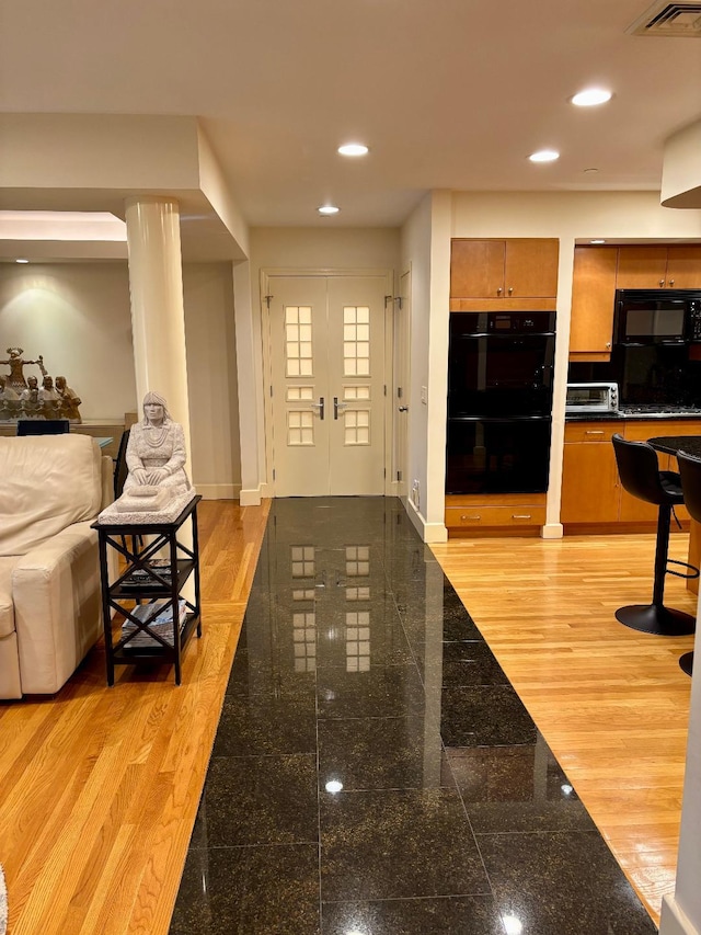 1 Portico Ct Unit 200, Great Neck, NY 11021 - foyer entrance with granite floors and recessed lighting