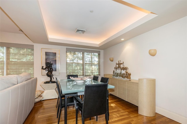 1 Portico Ct Unit 200, Great Neck, NY 11021 - dining space with a tray ceiling and wood finished floors