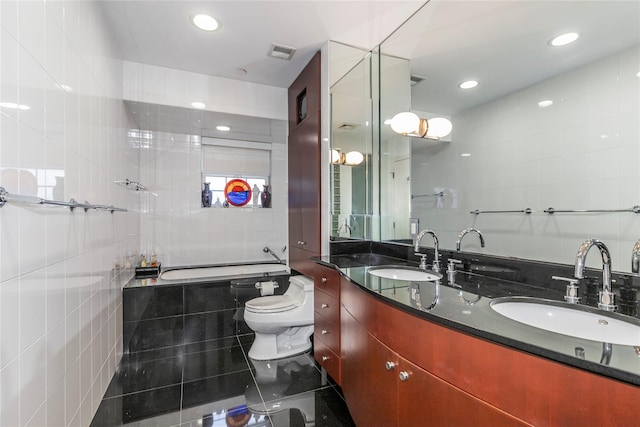 1 Portico Ct Unit 200, Great Neck, NY 11021 - bathroom with tile walls, a relaxing tiled tub, double vanity, and recessed lighting