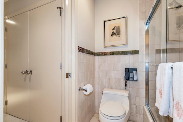 1 Portico Ct Unit 200, Great Neck, NY 11021 - bathroom featuring tile walls and shower / bath combination with glass door