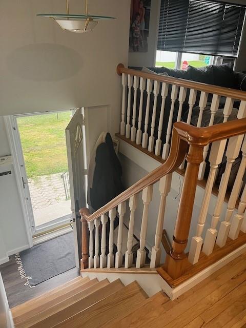 226 14th Ave, West Babylon, NY 11704 - stairs with plenty of natural light and wood finished floors