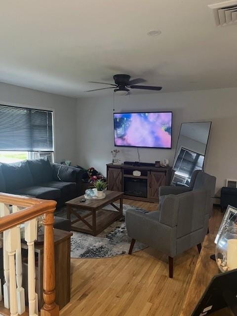 226 14th Ave, West Babylon, NY 11704 - living room with light wood-style floors and ceiling fan