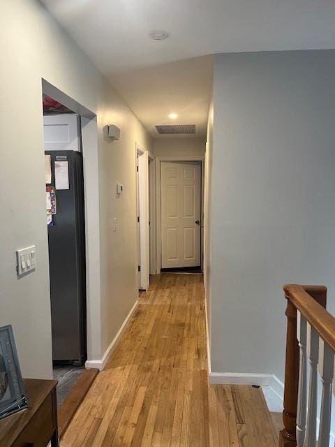 226 14th Ave, West Babylon, NY 11704 - hallway featuring light wood-style floors and baseboards