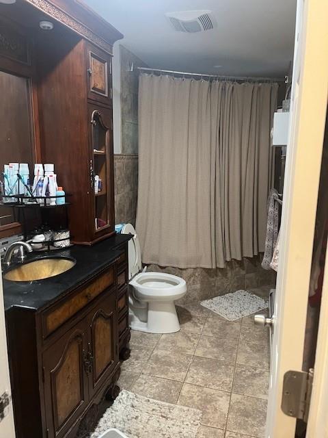 226 14th Ave, West Babylon, NY 11704 - bathroom featuring toilet and vanity