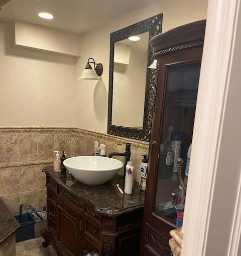 226 14th Ave, West Babylon, NY 11704 - bathroom with vanity, tile walls, a wainscoted wall, and recessed lighting