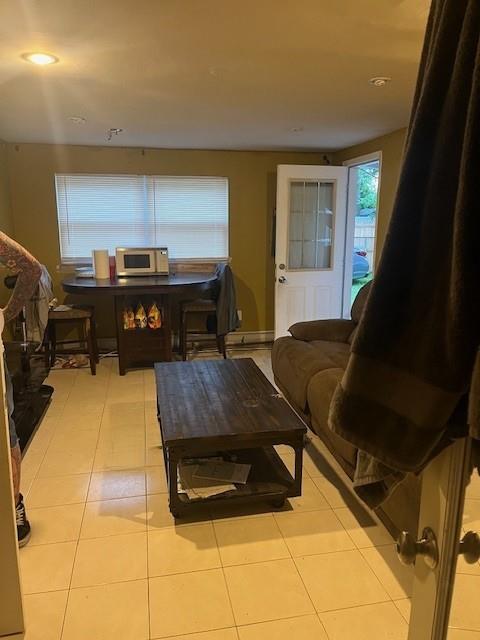 226 14th Ave, West Babylon, NY 11704 - living room featuring tile patterned flooring and recessed lighting