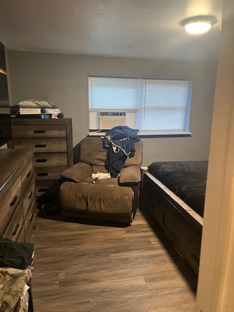 226 14th Ave, West Babylon, NY 11704 - bedroom with light wood-style floors, multiple windows, and cooling unit