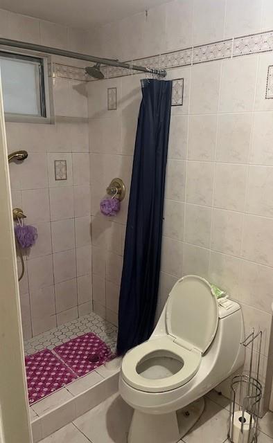 226 14th Ave, West Babylon, NY 11704 - bathroom with a shower stall and tile patterned flooring