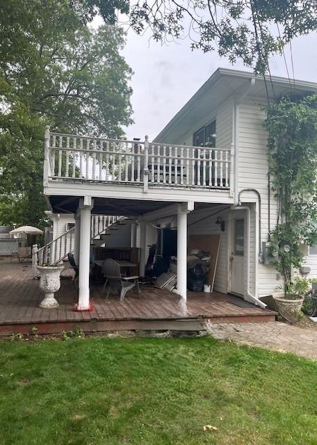 226 14th Ave, West Babylon, NY 11704 - rear view of house with a deck, a lawn, and stairs