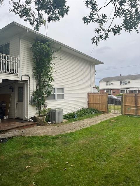226 14th Ave, West Babylon, NY 11704 - view of home's exterior featuring a central air condition unit and a balcony