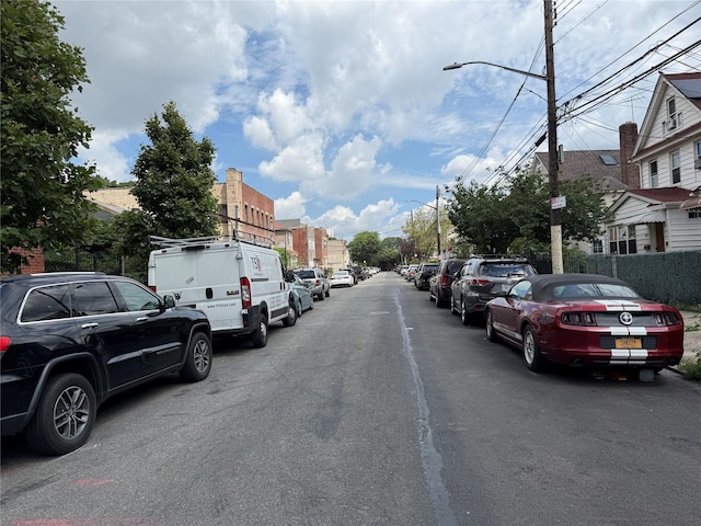 84-70 129th St Unit 2J, Kew Gardens, NY 11415 - view of asphalt street featuring street lighting and a residential view