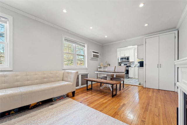 64-41 Springfield Blvd Unit B, Bayside, NY 11364 - living room featuring crown molding, light wood-style flooring, a wall mounted AC, recessed lighting, and radiator heating unit