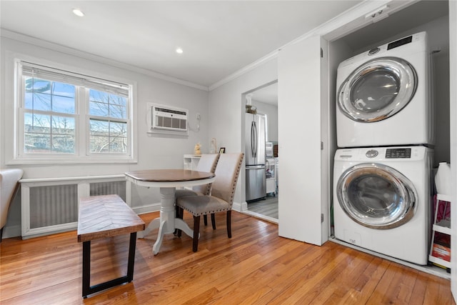 64-41 Springfield Blvd Unit B, Bayside, NY 11364 - laundry room featuring stacked washer / drying machine, crown molding, light wood-style floors, an AC wall unit, and recessed lighting