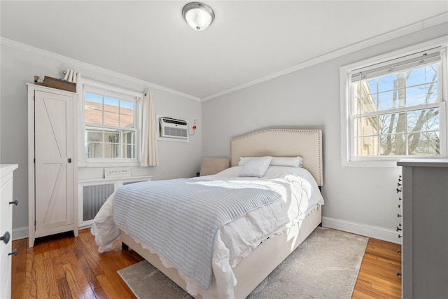 64-41 Springfield Blvd Unit B, Bayside, NY 11364 - bedroom with crown molding, wood finished floors, a wall mounted AC, and radiator heating unit