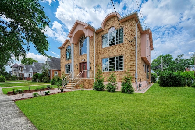 83-14 266th St, Glen Oaks, NY 11004 - view of front of house with brick siding and a front yard