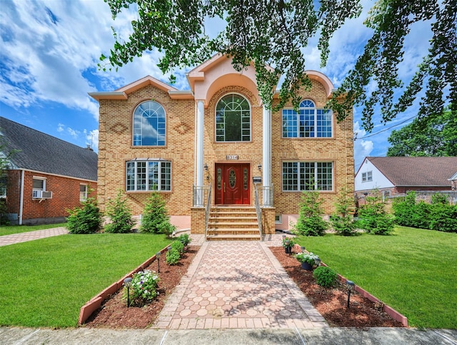 83-14 266th St, Glen Oaks, NY 11004 - traditional home with brick siding, a front yard, and cooling unit