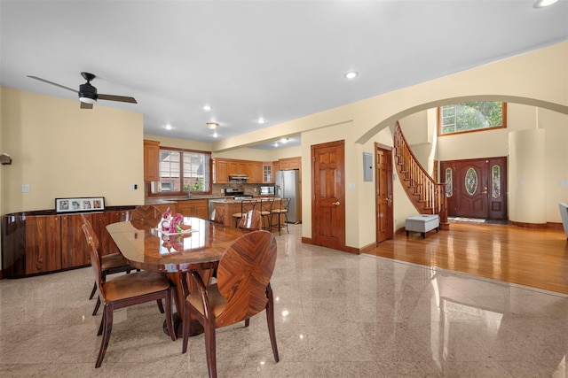 83-14 266th St, Glen Oaks, NY 11004 - dining area with arched walkways, granite tiled floors, recessed lighting, electric panel, and stairway