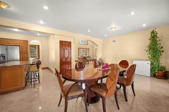 83-14 266th St, Glen Oaks, NY 11004 - dining room featuring arched walkways, recessed lighting, and granite floors