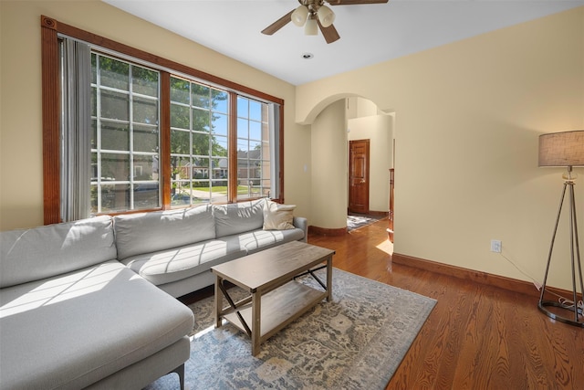 83-14 266th St, Glen Oaks, NY 11004 - living area with a ceiling fan, arched walkways, and wood finished floors