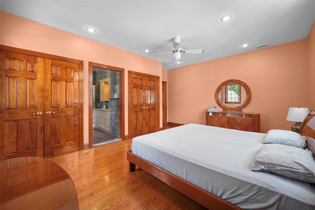 83-14 266th St, Glen Oaks, NY 11004 - bedroom featuring light wood-type flooring, recessed lighting, a ceiling fan, and ensuite bath