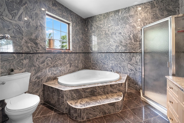 83-14 266th St, Glen Oaks, NY 11004 - bathroom with a bath, marble tiled flooring, a stall shower, and tile walls