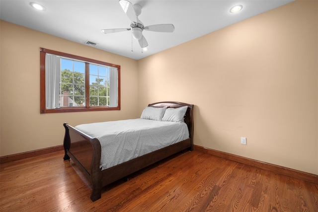 83-14 266th St, Glen Oaks, NY 11004 - bedroom with wood finished floors, a ceiling fan, and recessed lighting