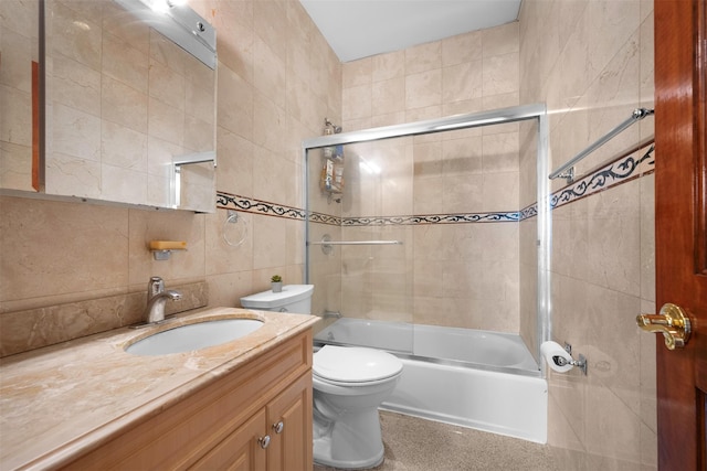 83-14 266th St, Glen Oaks, NY 11004 - full bathroom with tile walls, vanity, and shower / bath combination with glass door