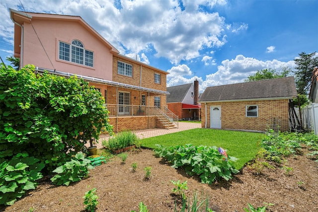 83-14 266th St, Glen Oaks, NY 11004 - back of house with brick siding and an outbuilding