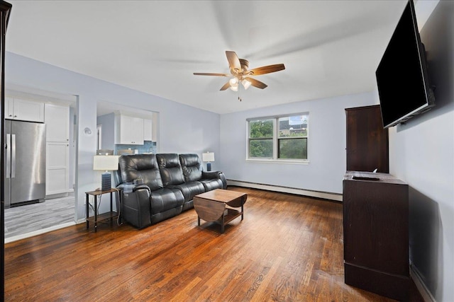 1690 Grand Ave Unit A16, Baldwin, NY 11510 - living room with a baseboard radiator, ceiling fan, and wood finished floors