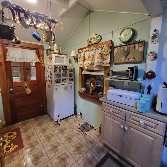 28 E Sullivan Pl, Smallwood, NY 12720 - kitchen with white appliances and vaulted ceiling