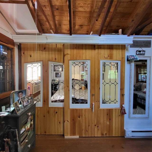 28 E Sullivan Pl, Smallwood, NY 12720 - detailed view of a baseboard radiator, wooden walls, wood finished floors, and a wood ceiling with exposed beams