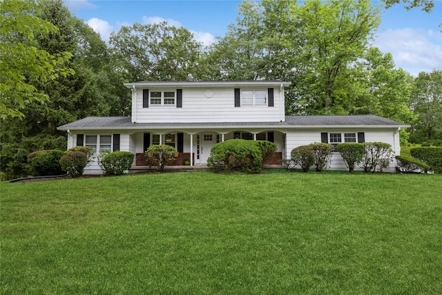 43 Woodglen Dr, New City, NY 10956 - traditional home featuring covered porch, a front lawn, and roof with shingles