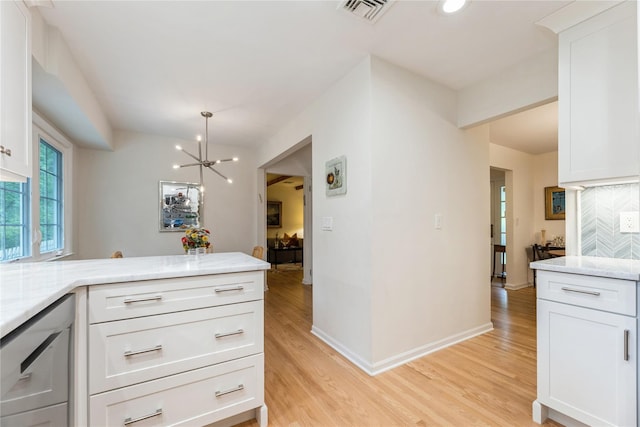 43 Woodglen Dr, New City, NY 10956 - kitchen featuring light wood-style floors, white cabinetry, a chandelier, light stone countertops, and recessed lighting