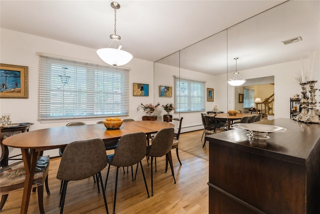 43 Woodglen Dr, New City, NY 10956 - dining area featuring baseboard heating and light wood-type flooring