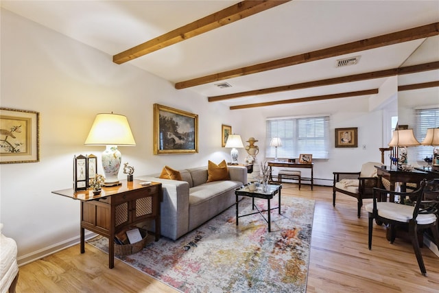 43 Woodglen Dr, New City, NY 10956 - living area featuring baseboard heating, beamed ceiling, and light wood-style floors