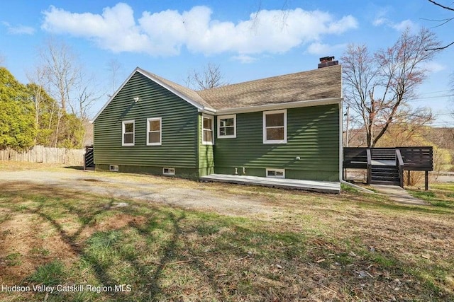 1601 Rte 199, Red Hook, NY 12571 - rear view of property featuring a chimney, a deck, and a lawn
