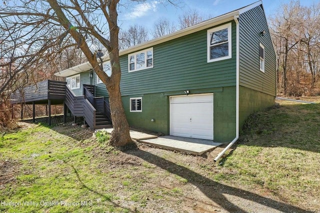1601 Rte 199, Red Hook, NY 12571 - back of house featuring stairway, a garage, a wooden deck, and dirt driveway