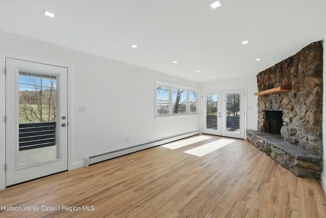 1601 Rte 199, Red Hook, NY 12571 - unfurnished living room with a baseboard radiator, french doors, light wood-type flooring, plenty of natural light, and recessed lighting