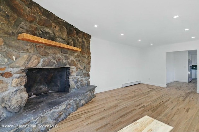 1601 Rte 199, Red Hook, NY 12571 - unfurnished living room featuring baseboard heating, wood finished floors, recessed lighting, and a fireplace
