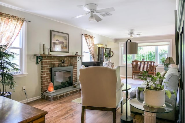 7 Clover Ln, Brookhaven, NY 11719 - dining room with a ceiling fan, a fireplace, light wood-style floors, and ornamental molding