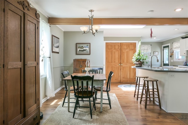 7 Clover Ln, Brookhaven, NY 11719 - dining area featuring wood finished floors, recessed lighting, crown molding, and a chandelier