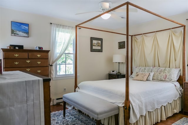 7 Clover Ln, Brookhaven, NY 11719 - bedroom featuring a baseboard radiator, wood finished floors, and ceiling fan