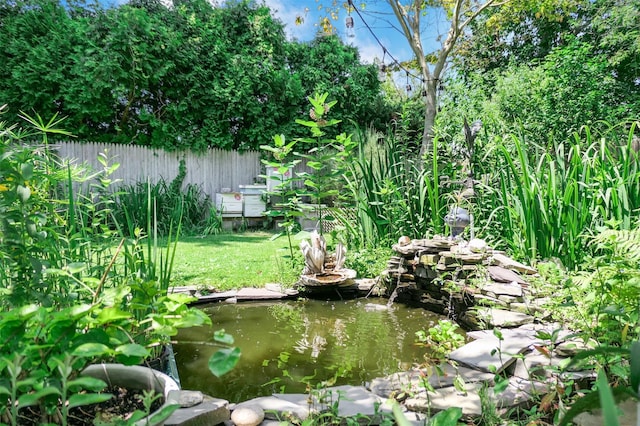 7 Clover Ln, Brookhaven, NY 11719 - view of yard featuring a garden pond